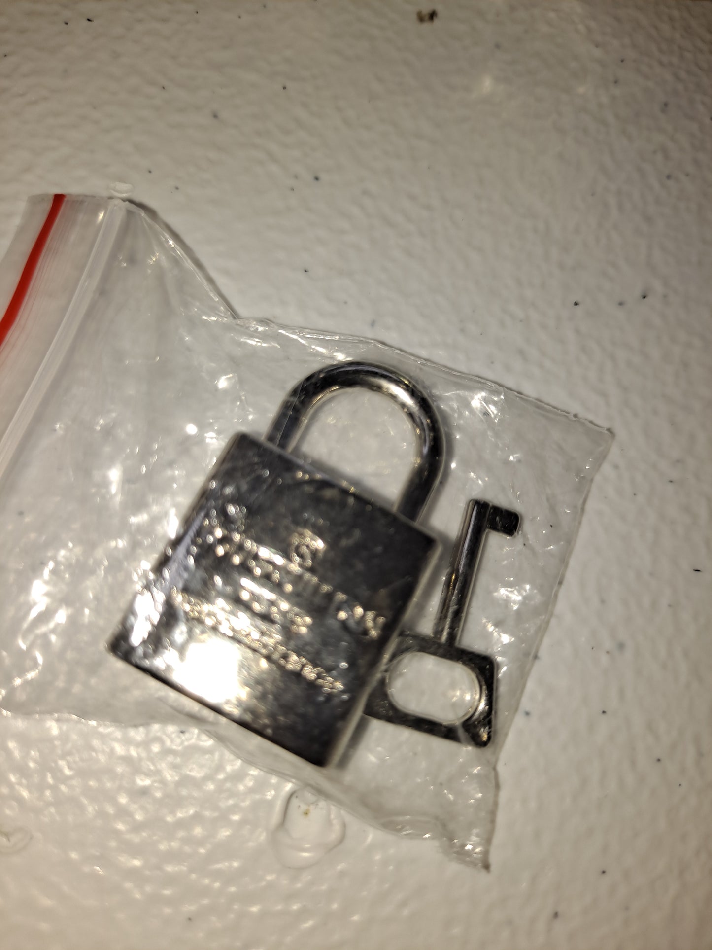 LV LOCK & KEY CROSSBODY BAG
