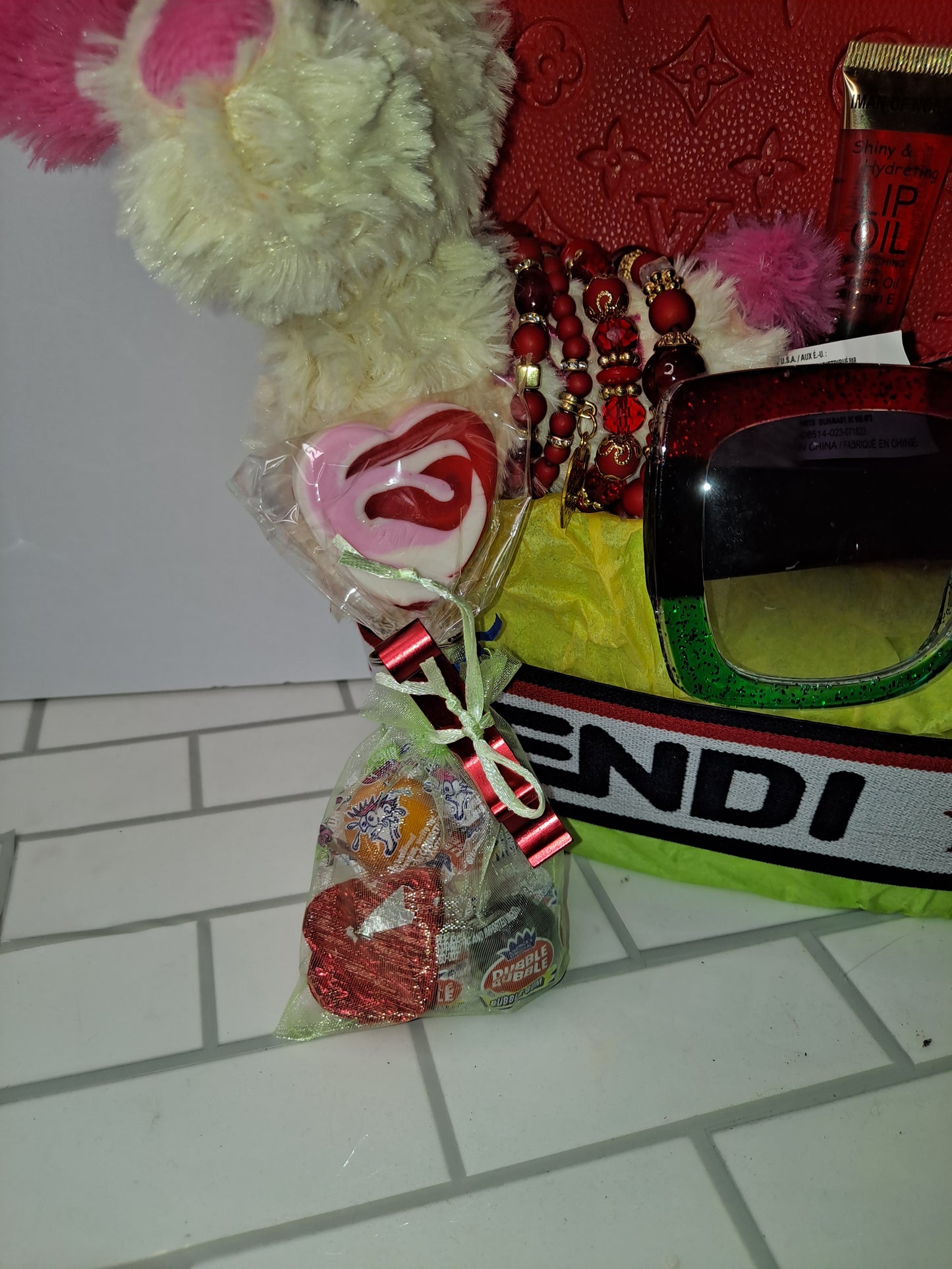 GIFT BASKETS BAG, WALLET, SUNGLASSES, HEADBAND LIP GLOSS, BOTTLE OPENER, 4 STACK BRACELETS.