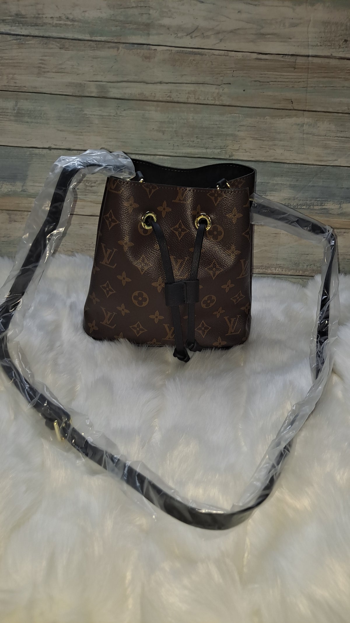 LOUISV BUCKET CROSSBODY BAG